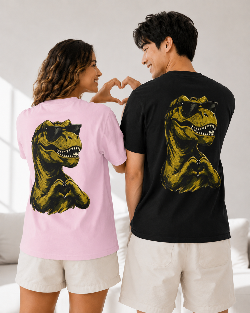 Couple wearing I Rawr You T-Rex back print graphic tees by QUOTEZ